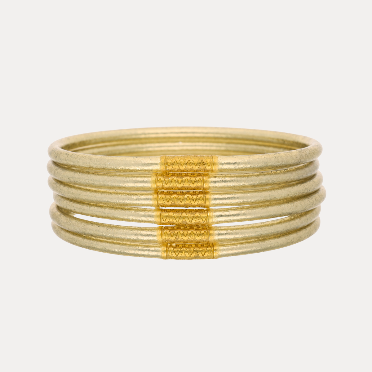 a stack of gold bracelets