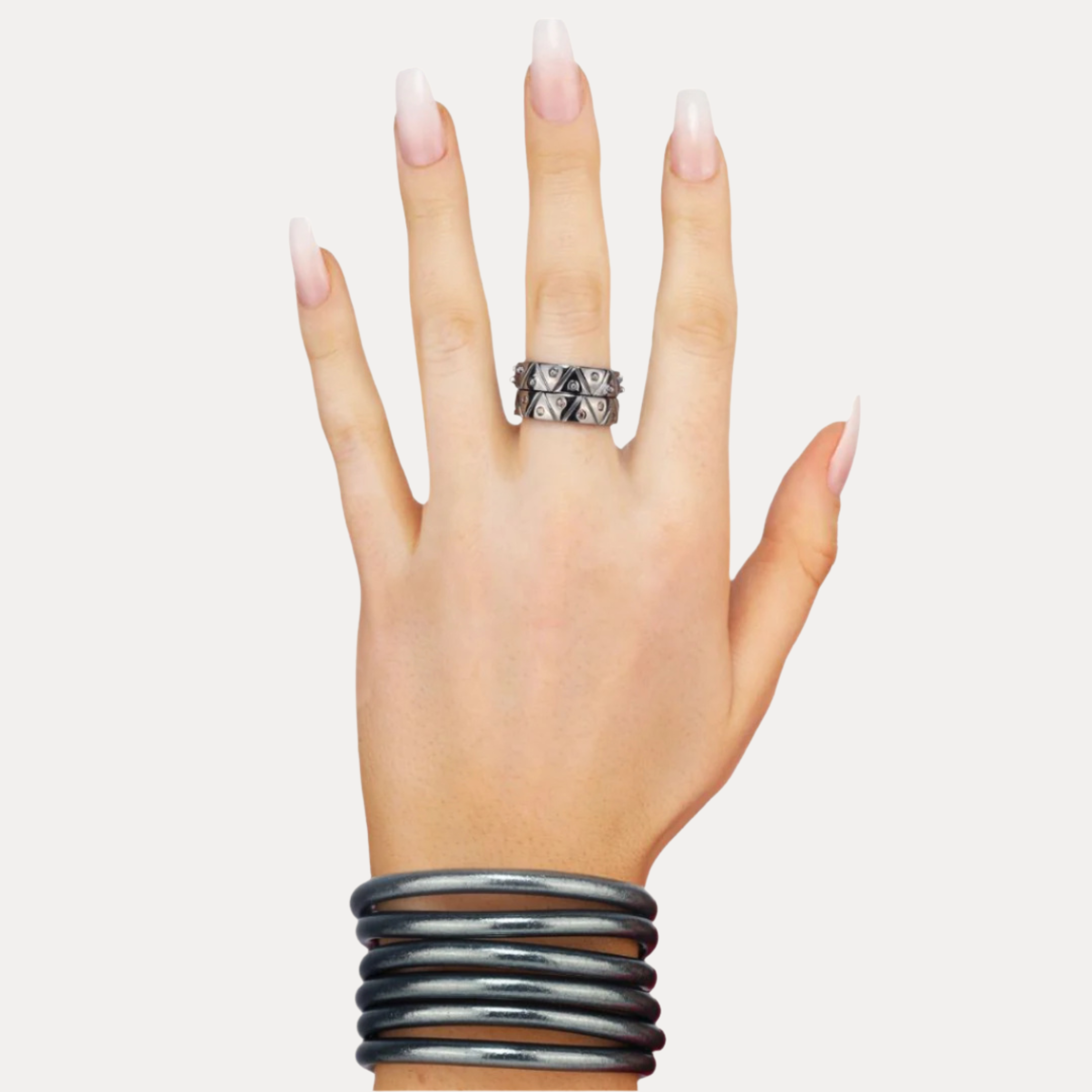 a hand with long nails and a ring on it