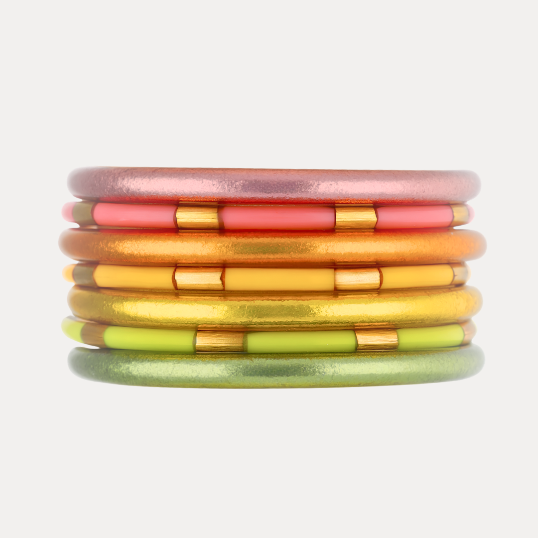 a stack of colorful bracelets