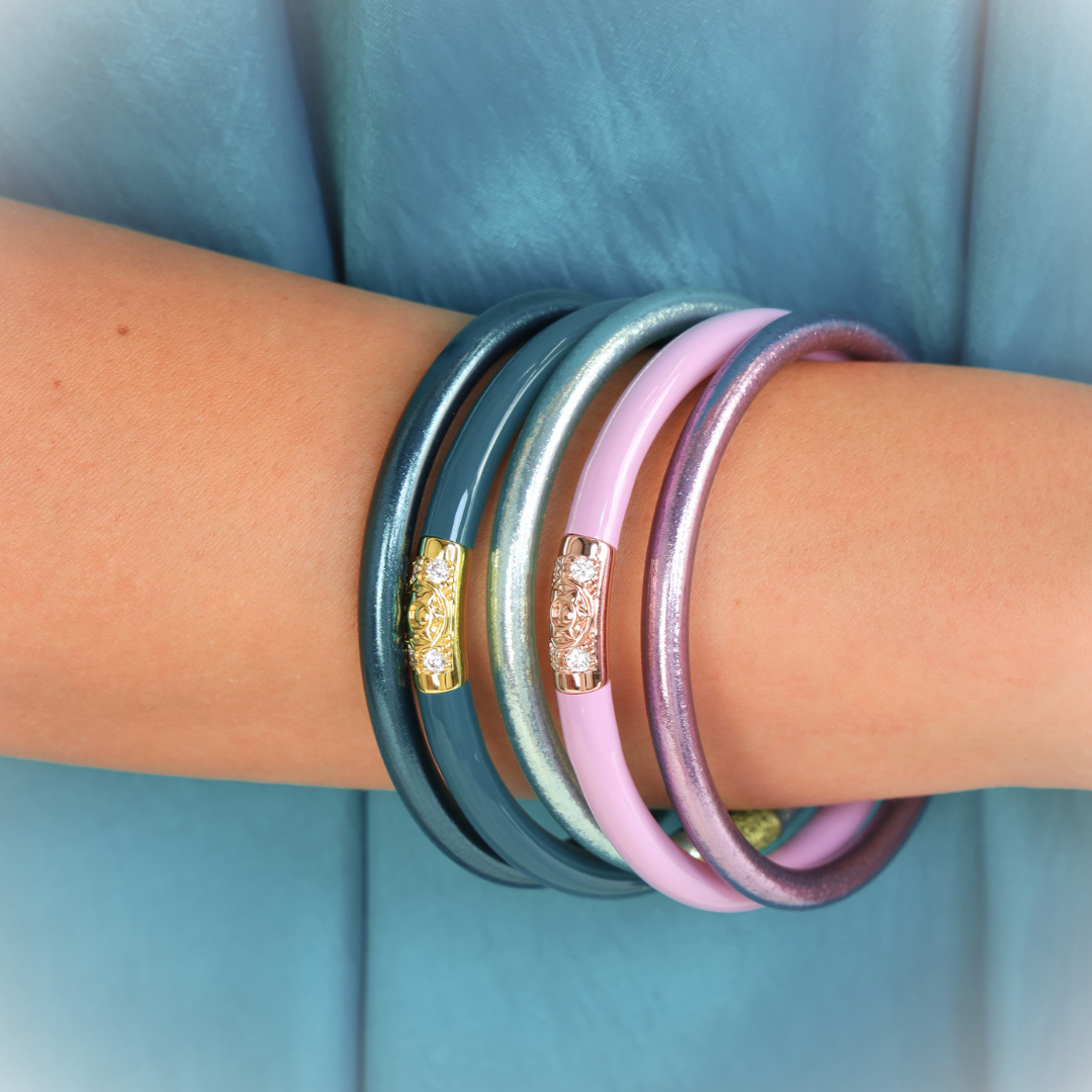 a person wearing bracelets on their arm