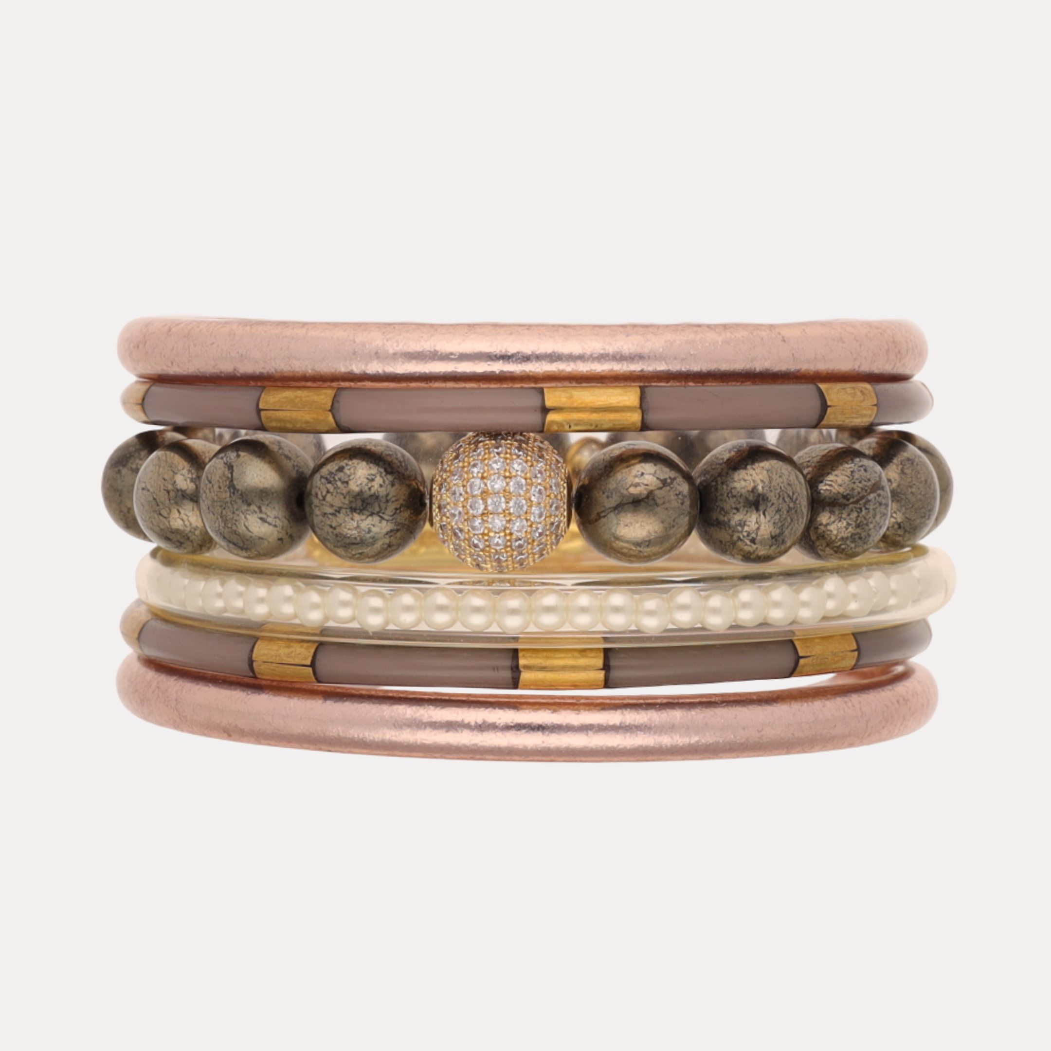 Stack of multicolored bracelets on a white background