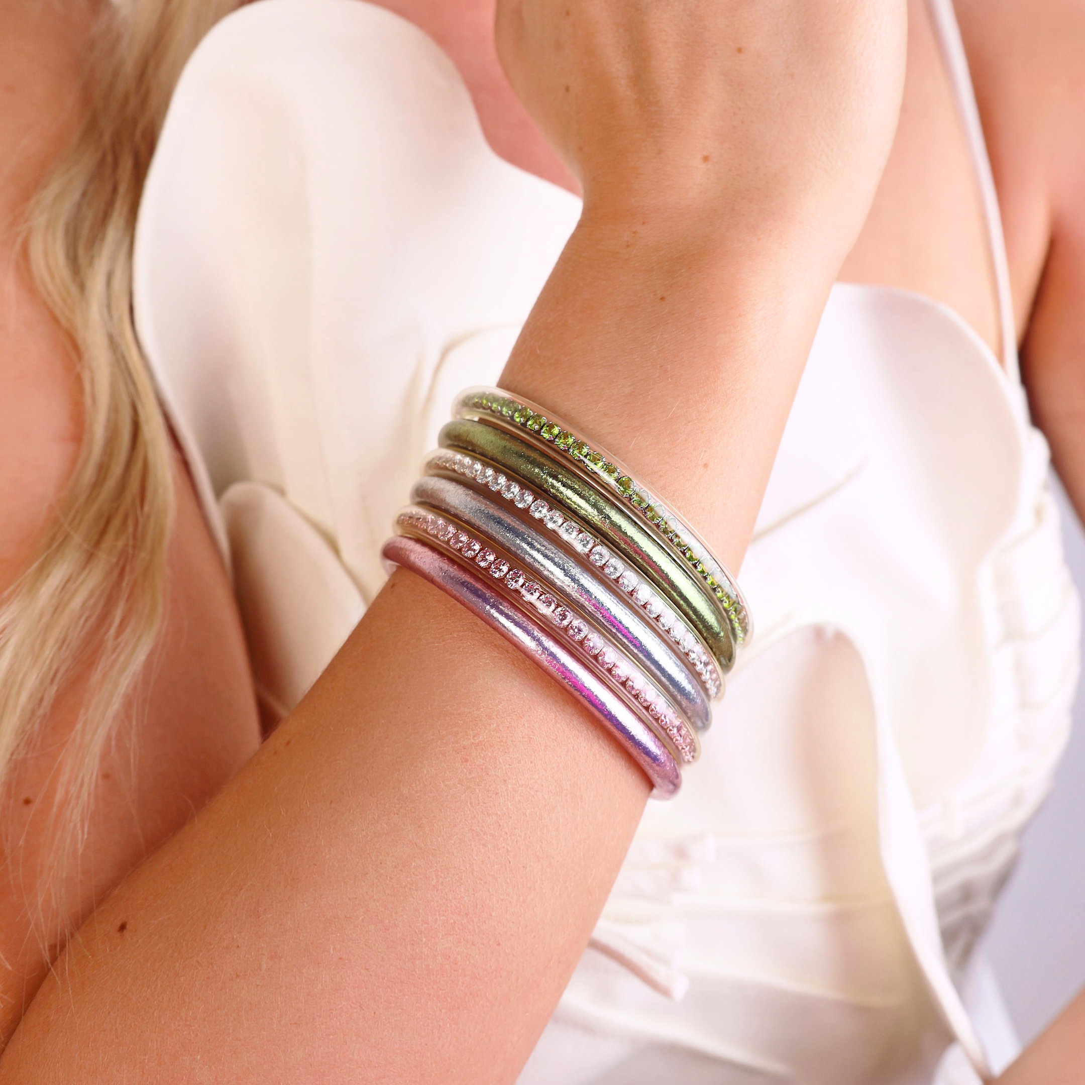 a woman wearing bracelets on her wrist