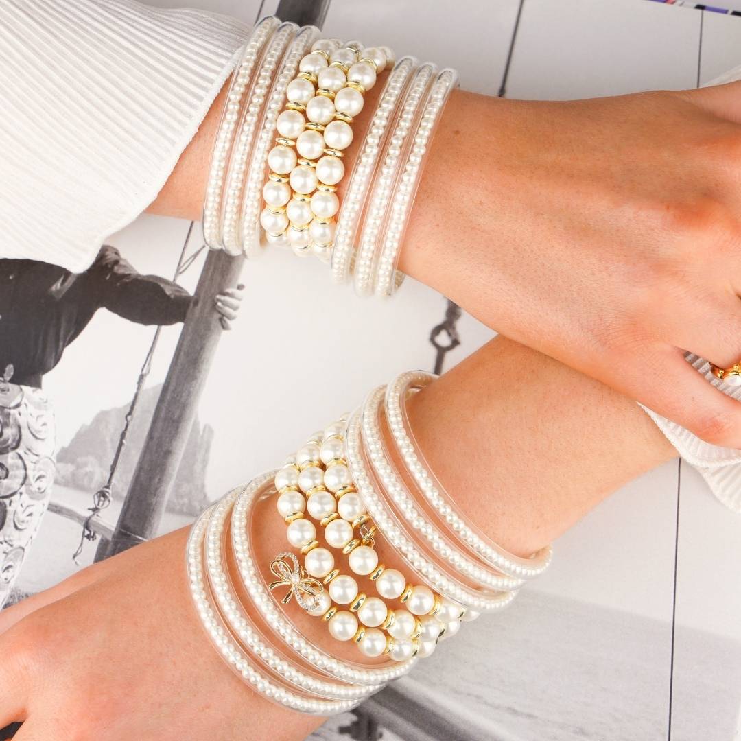 White Pearl Three Queens All Weather Bangles and White Pearl Wrap Bracelet with Gold Bow Charm | BuDhaGirl