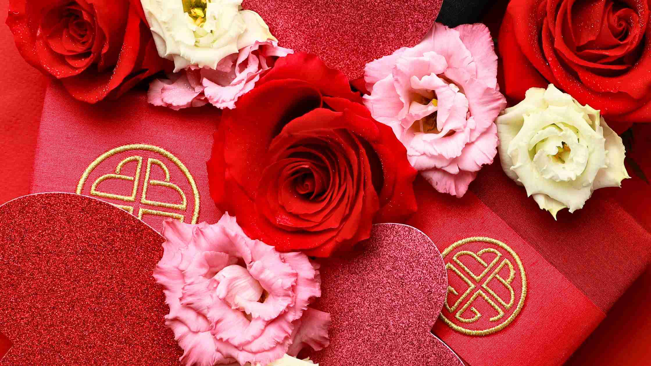 Flat Lay of BuDhaGirl Red Silk Jewelry Boxes with Red, Pink, and White Roses for Valentine's Day | BuDhaBrief by BuDhaGirl