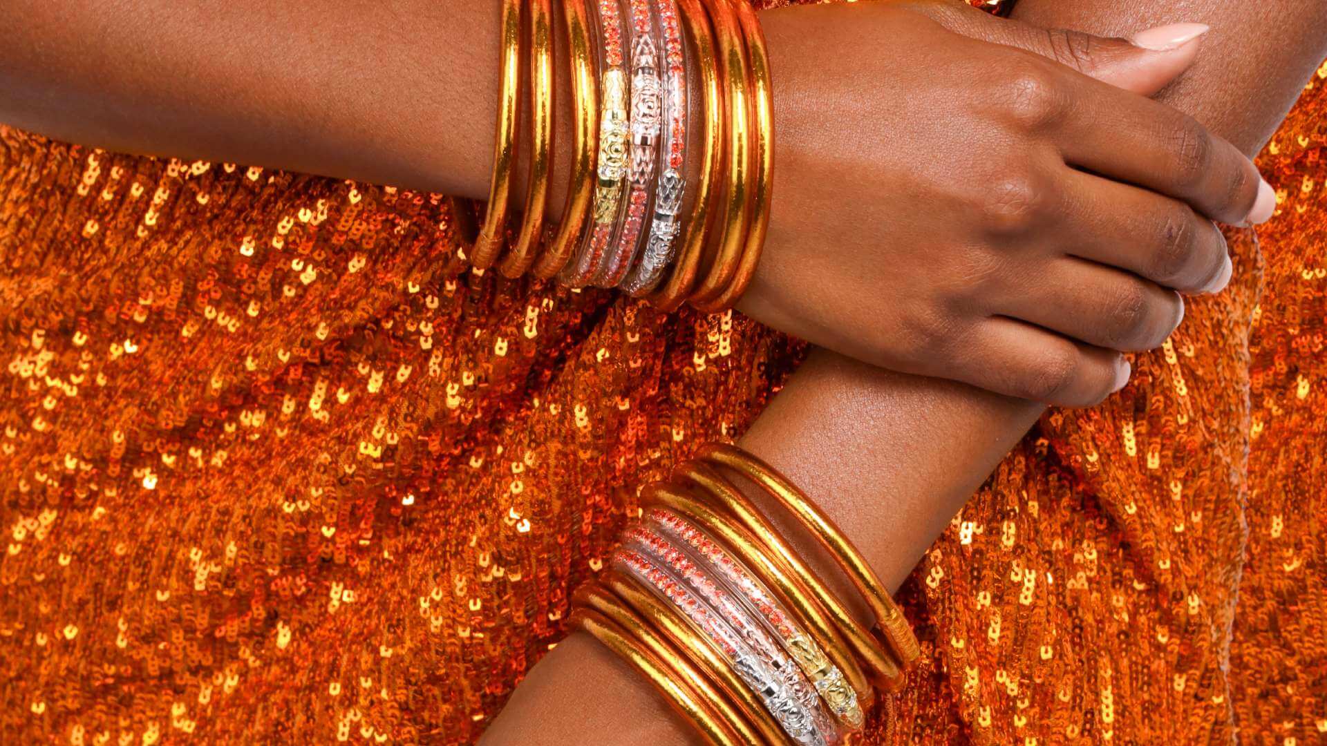 Orange Gold Bangle Bracelets on Model in Orange Sequin Dress | Spark Collection Banner | BuDhaGirl