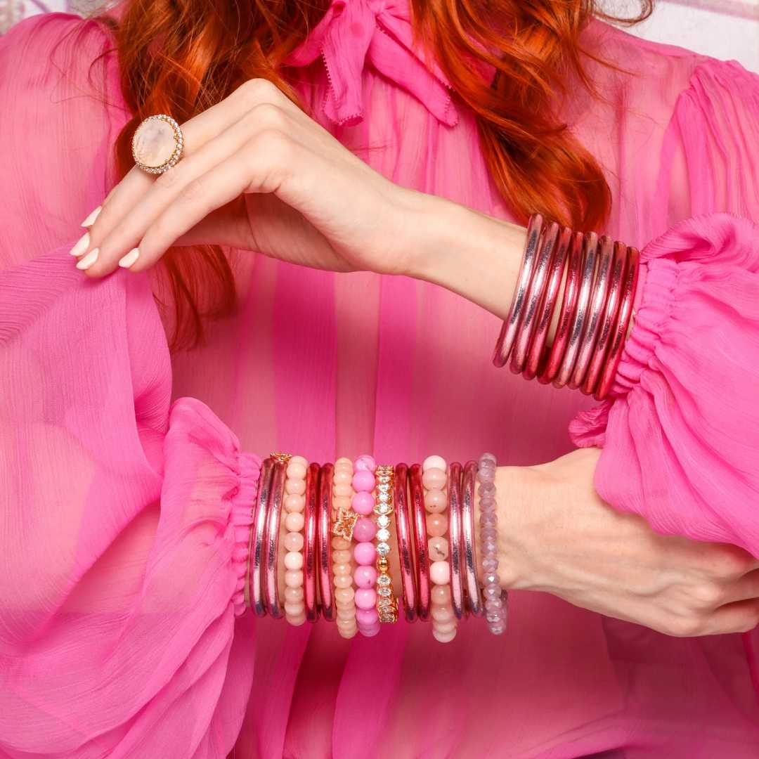 Model's hands wearing Carousel Pink All Weather Bangles With Chamonix Beaded Bracelet Set | BuDhaGirl