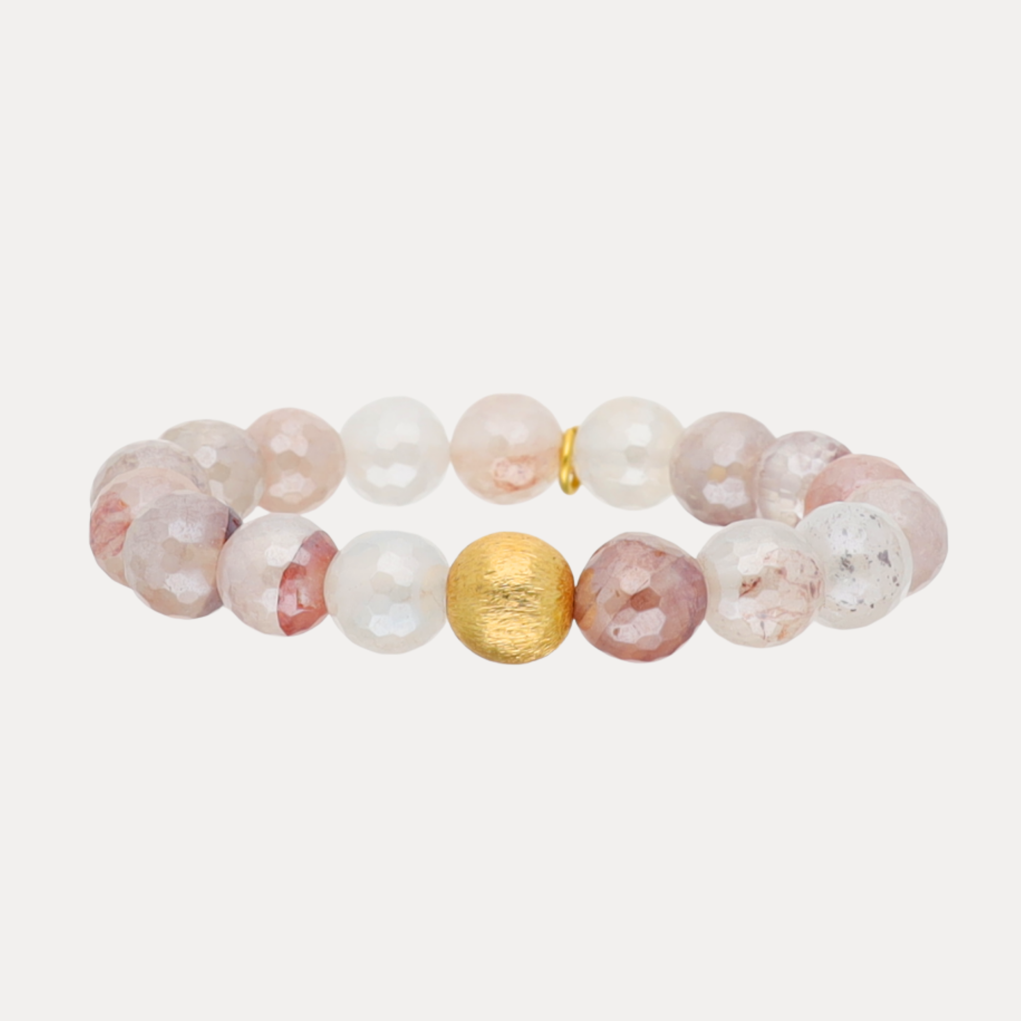 a bracelet with a gold bead