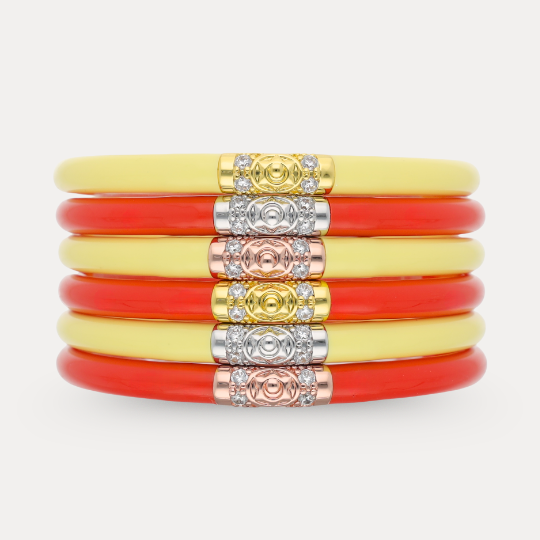 a stack of red and yellow bracelets
