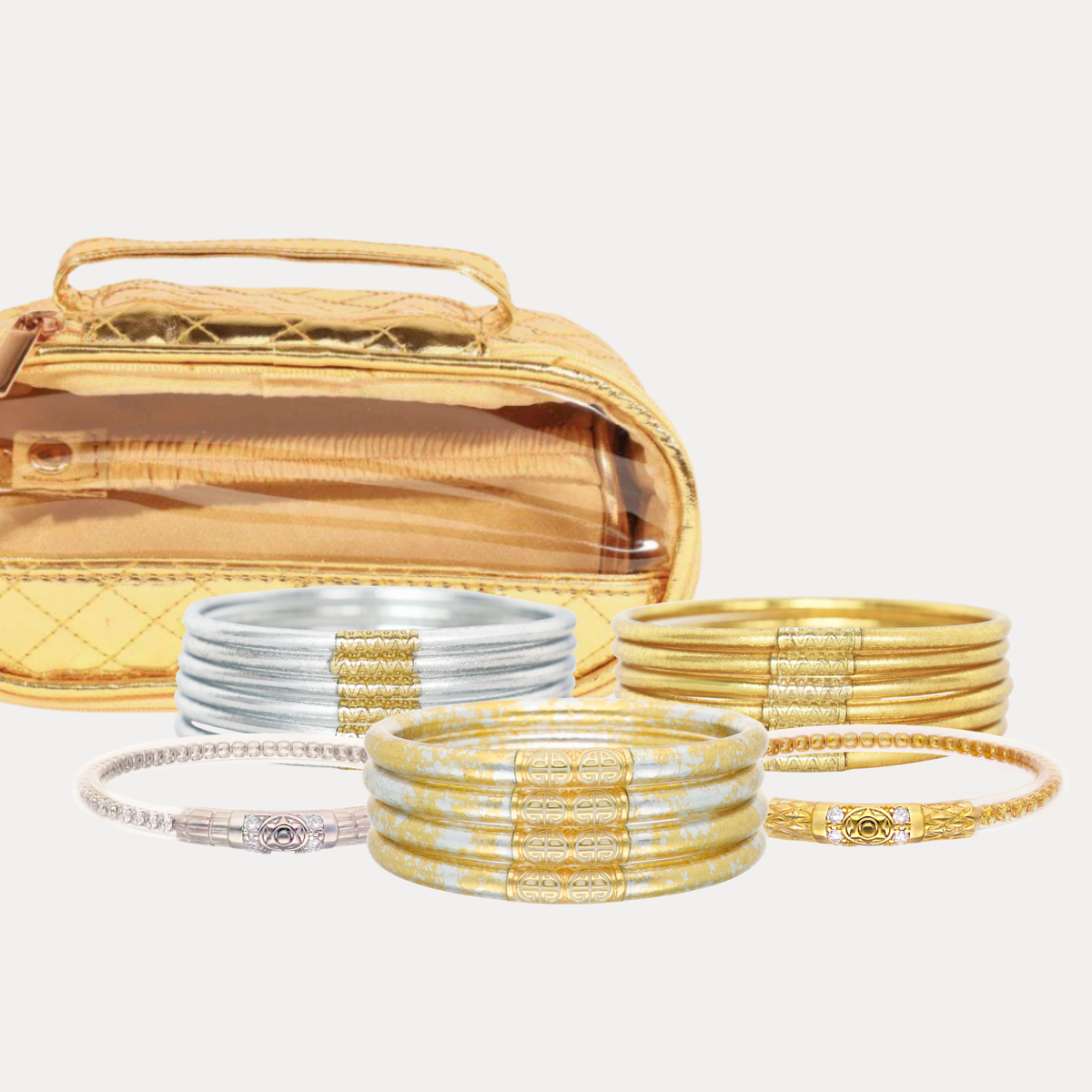 BuDhaGirl bangle bracelets for women in silver gold and marbled ivory tones displayed with a metallic travel case