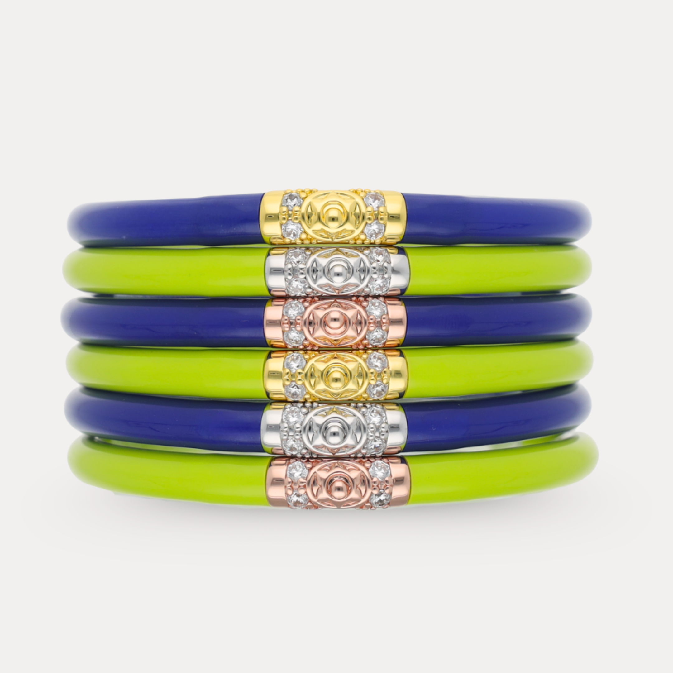 a stack of bracelets with gold and blue bracelets