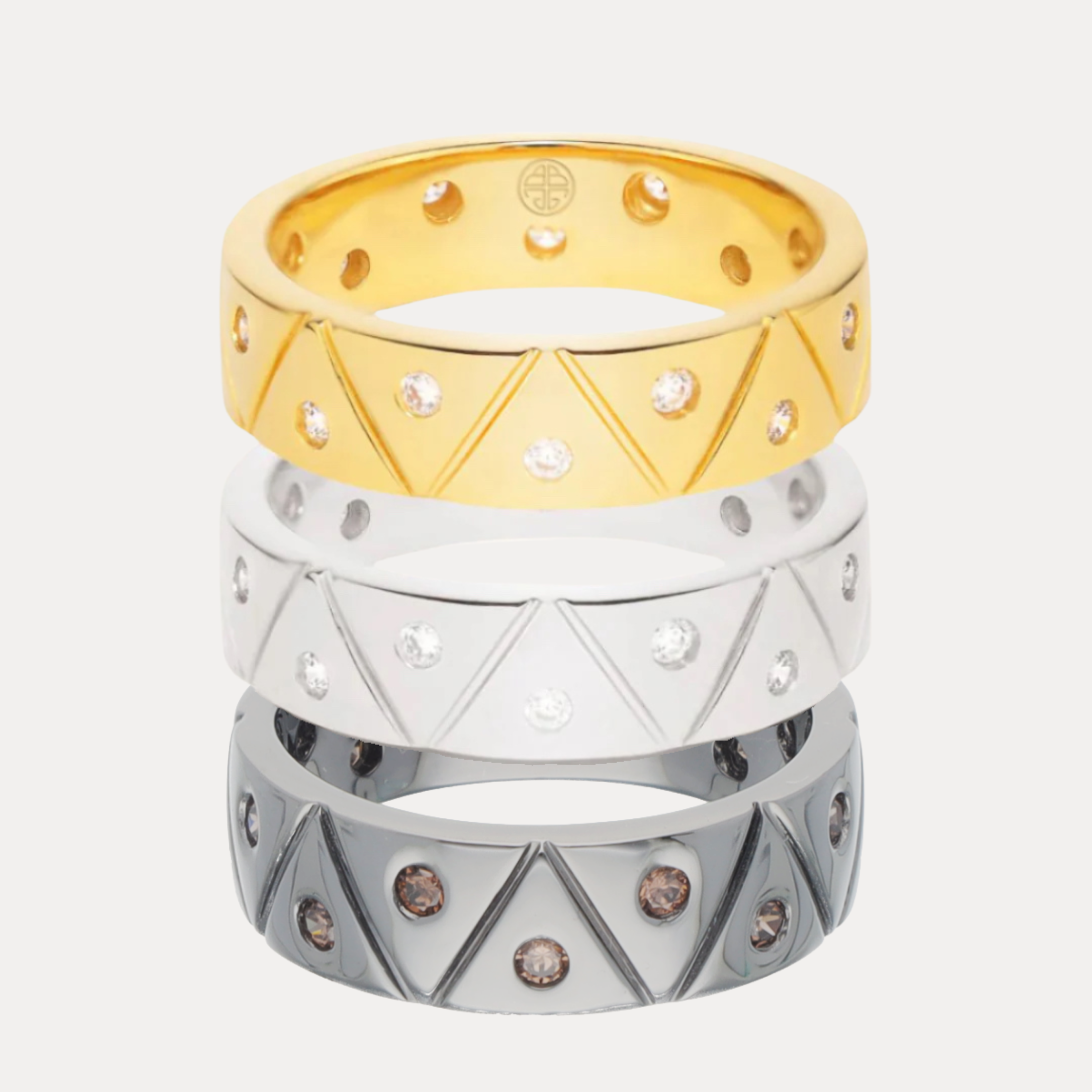 a stack of rings with diamonds