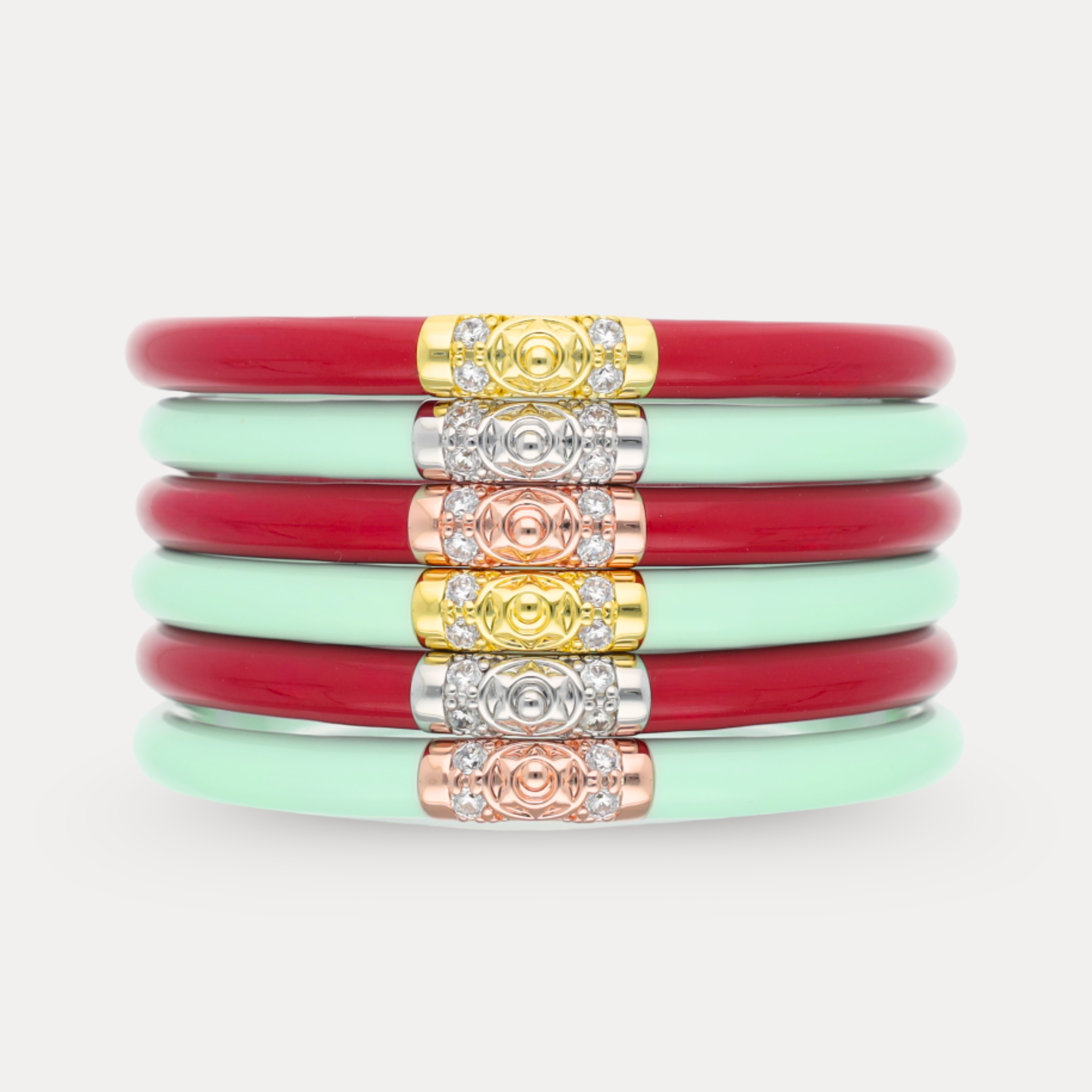 a stack of red and green bracelets