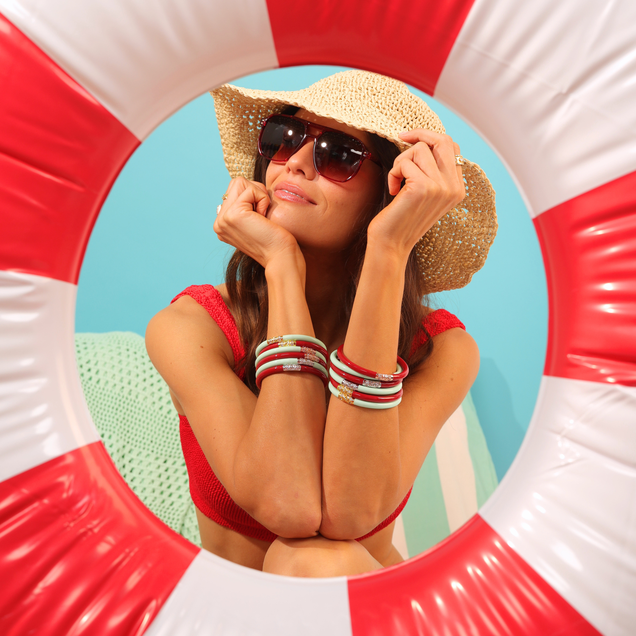 a woman in a swimsuit and hat