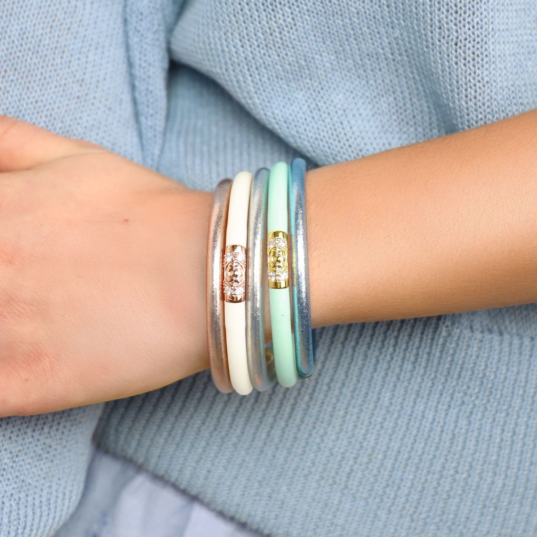 a person wearing bracelets on their wrist