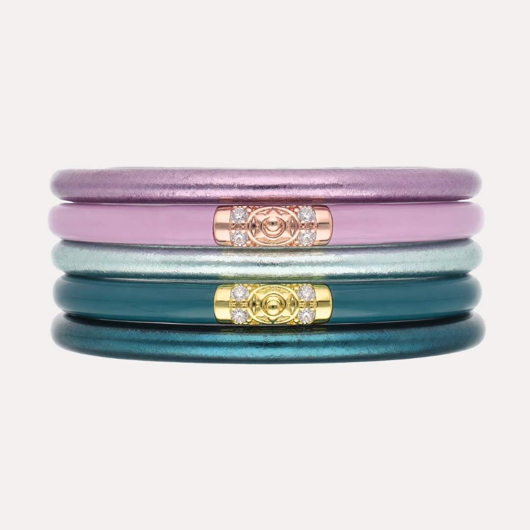 a stack of colorful bracelets