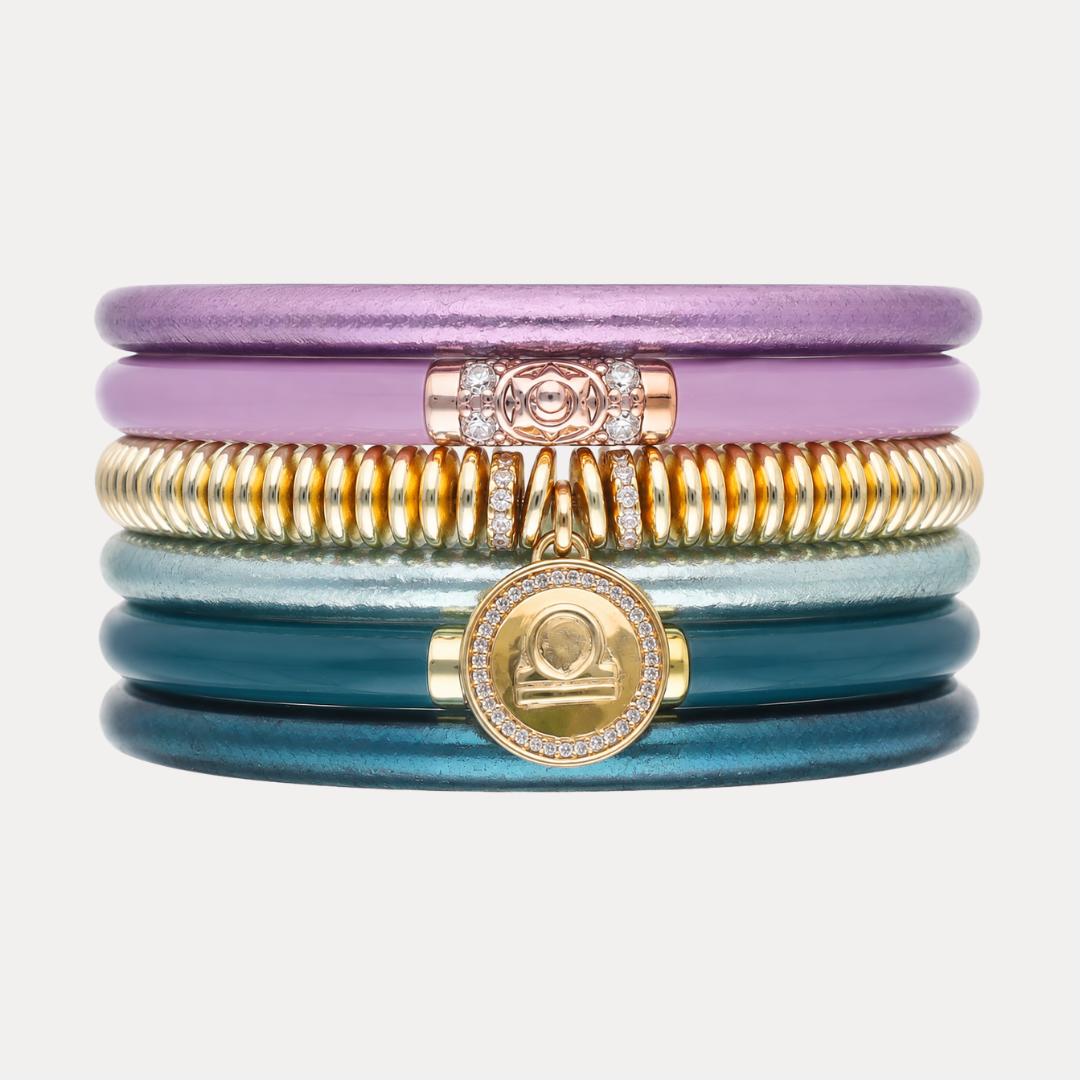 a stack of colorful bracelets