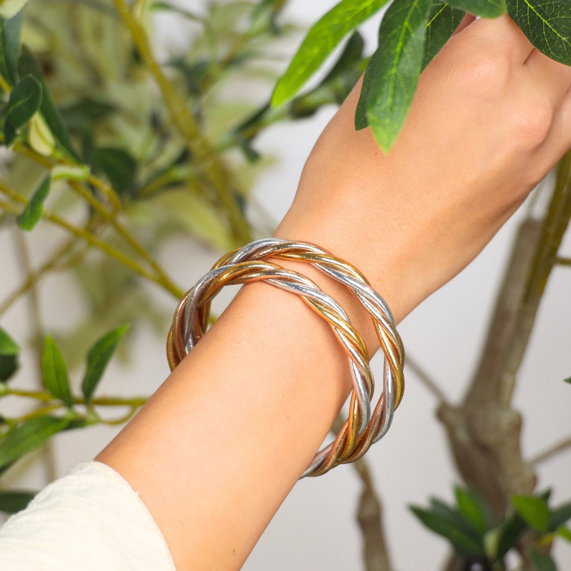 a person wearing bracelets on their wrist