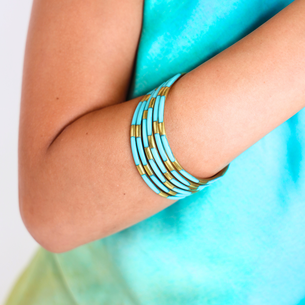 a person wearing bracelets on their arm