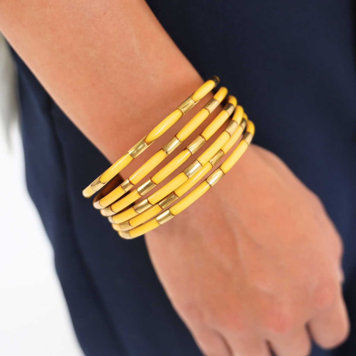 a person wearing yellow bracelets
