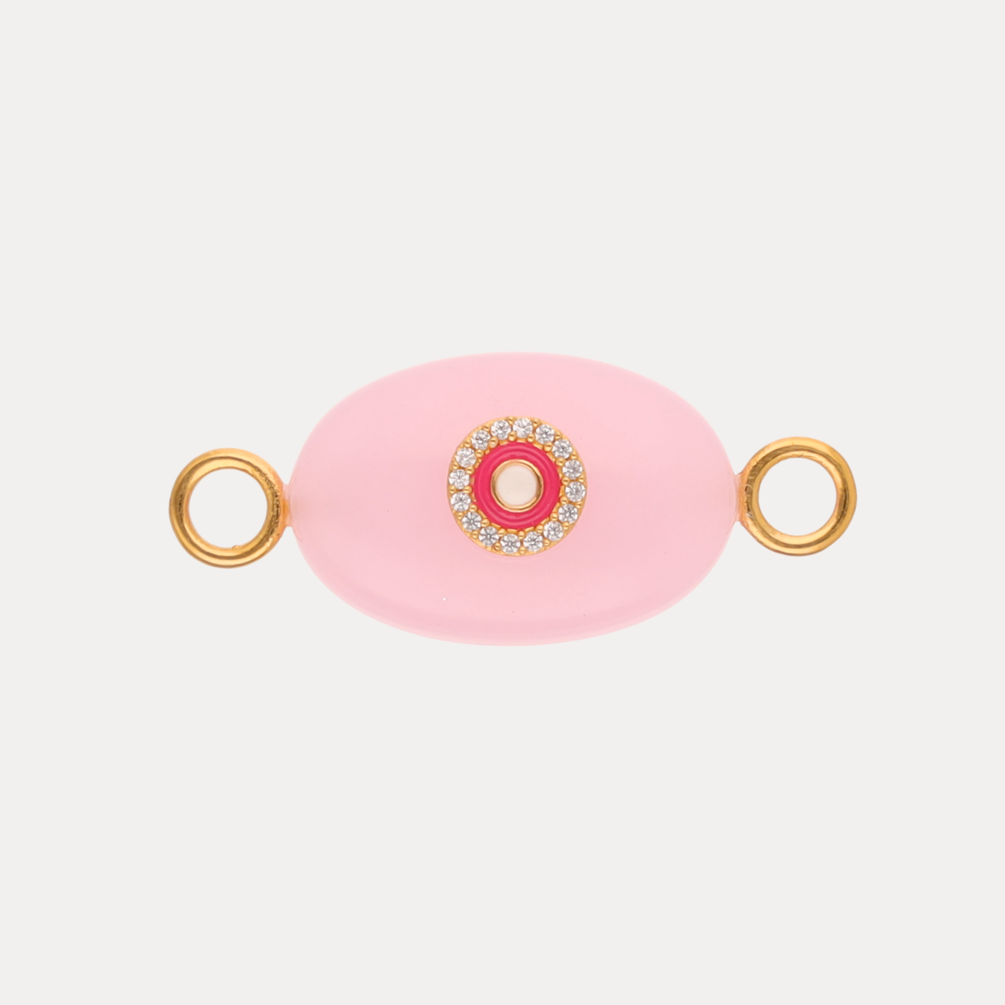 a pink and gold object with a pink circle and a pink circle with a pink center