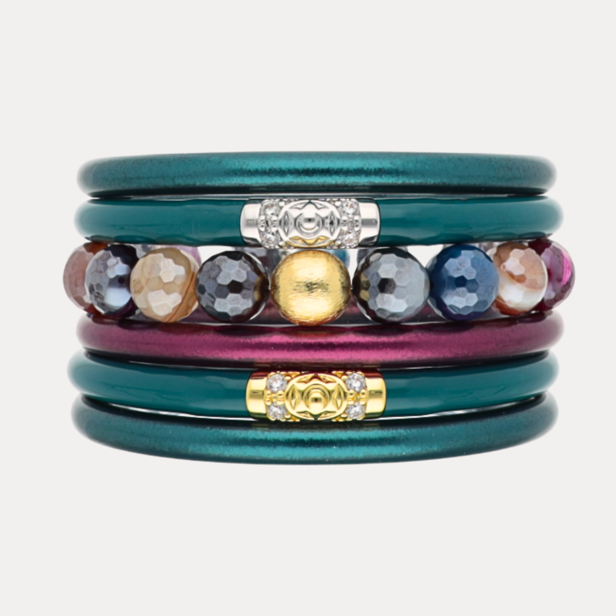 a stack of colorful bracelets